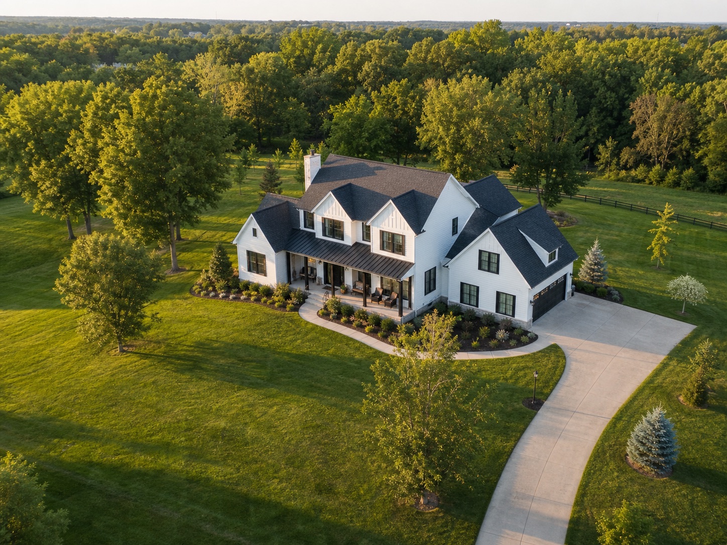 Aerial view of an Ohio home surrounded by green trees